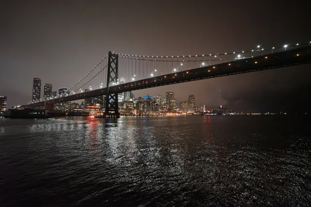 The Bay Bridge and the San Francisco skyline lit up at night