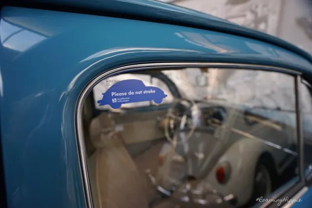 Looking through the window of a blue classic Volkswagen