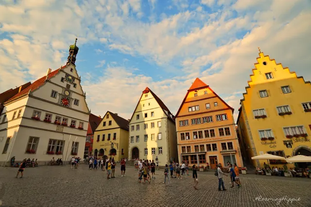 Colourful gabled buildings around a busy market square